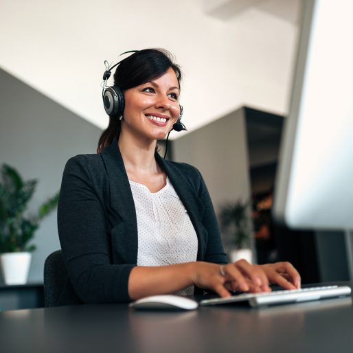 Close-up image of happy woman with headset.