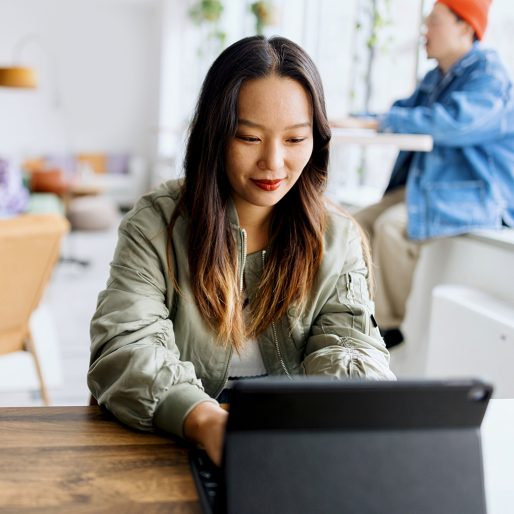 Young businesswoman using a digital tablet while at work