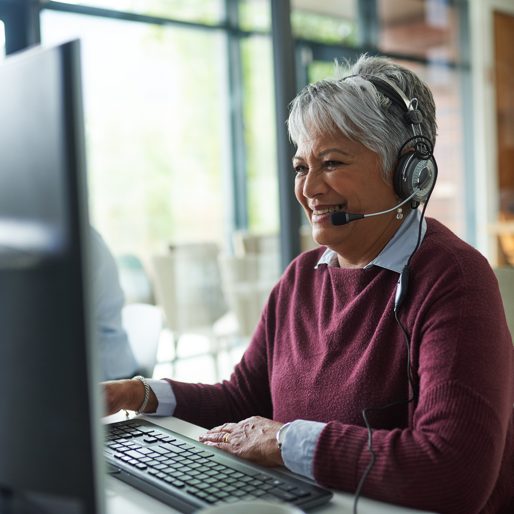 Shot of a mature woman working on a computer in a call centre