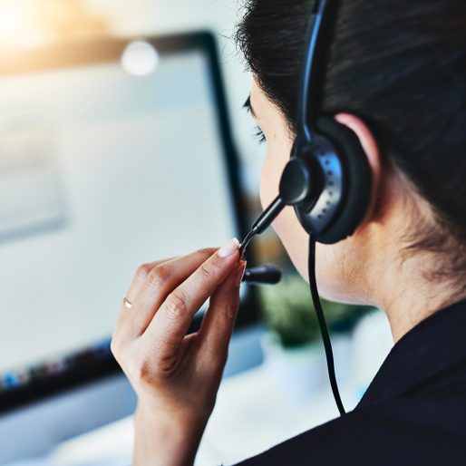 Rearview shot of a young woman working in a call centre